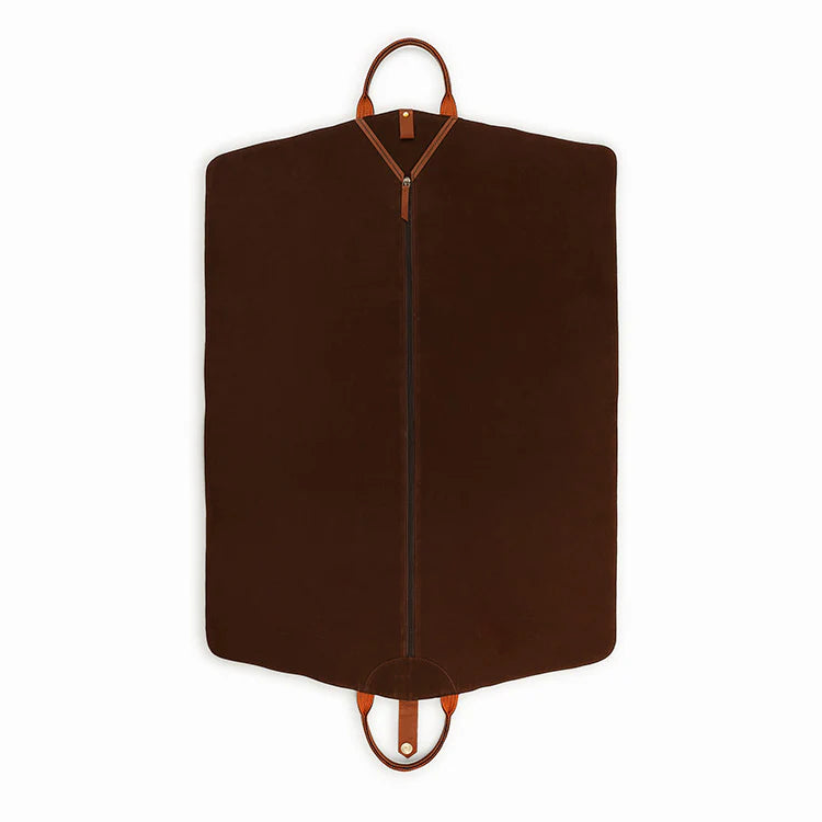 Brown garment bag with leather handles on a white background
