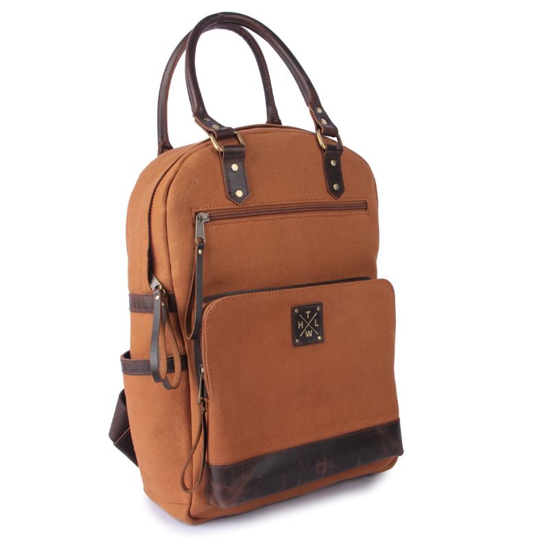 Brown backpack with leather accents on a white background