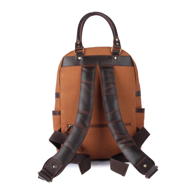 Brown backpack with leather straps on a white background