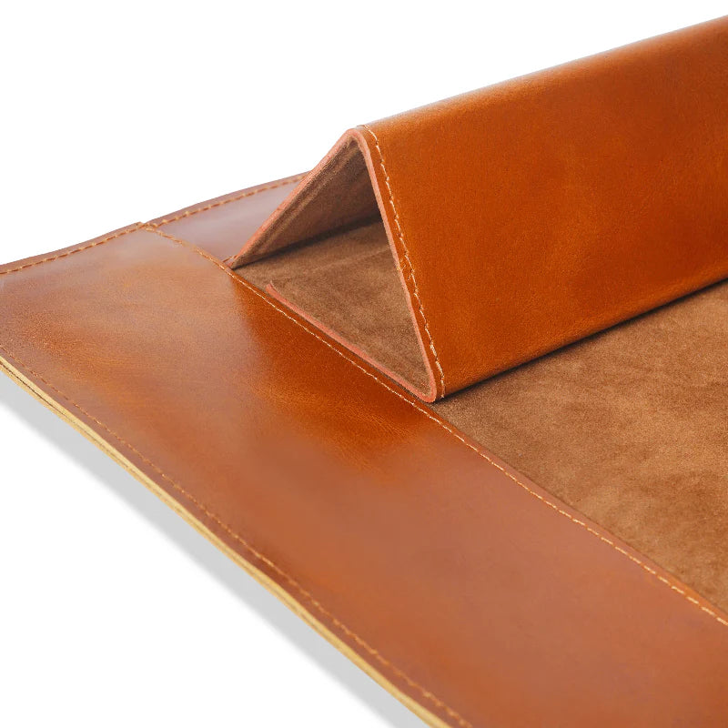 Close-up of a brown leather Laptop with a white background