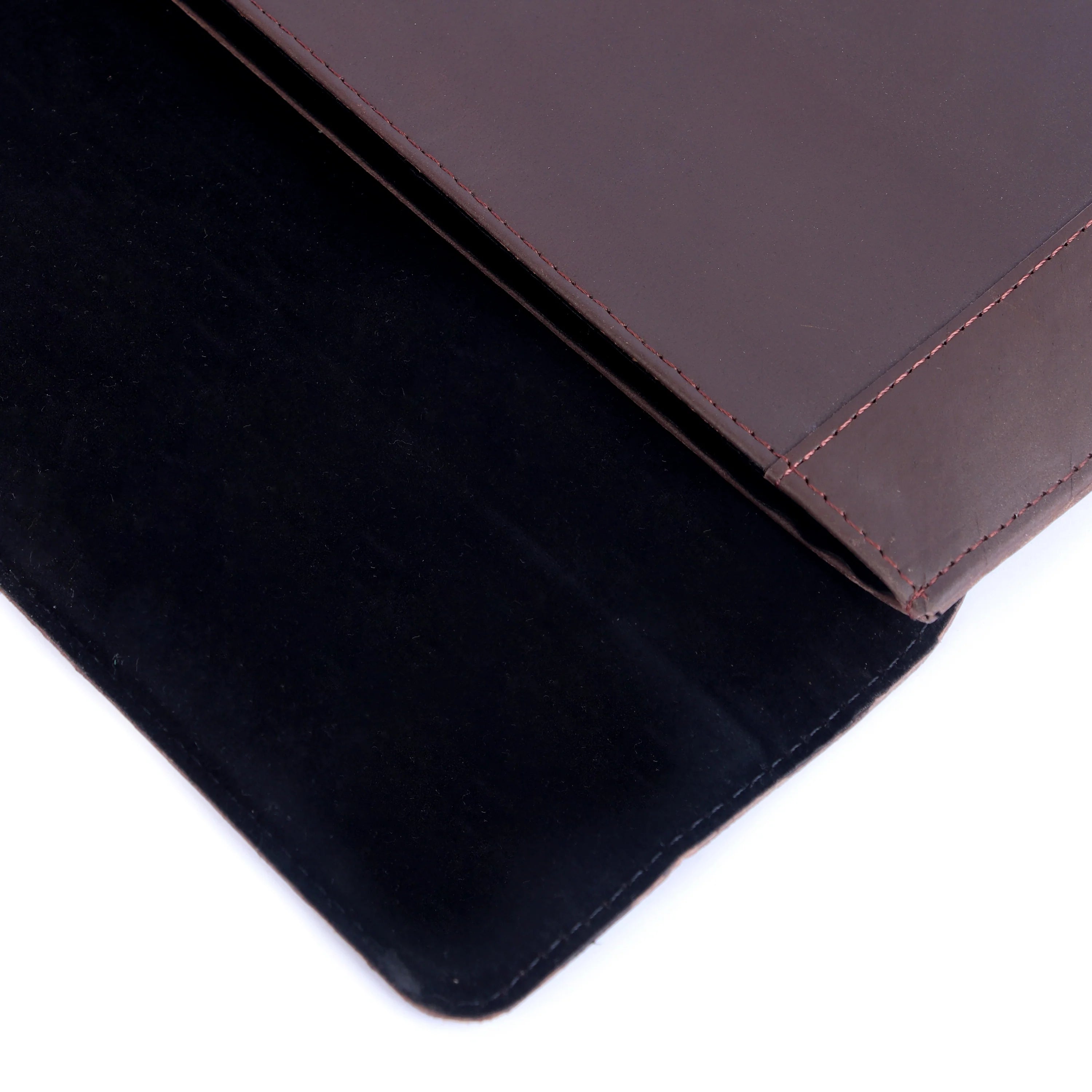 Close-up of a brown leather product on a black surface