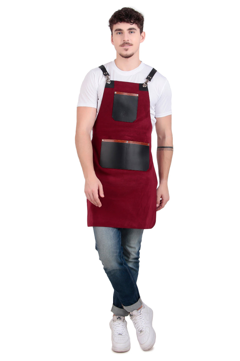 Man wearing a red apron with black pockets on a white background