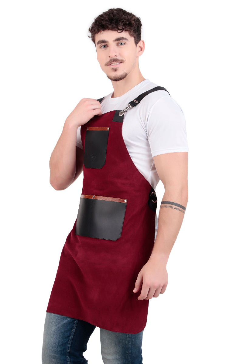 Man wearing a red apron with black pockets on a white background