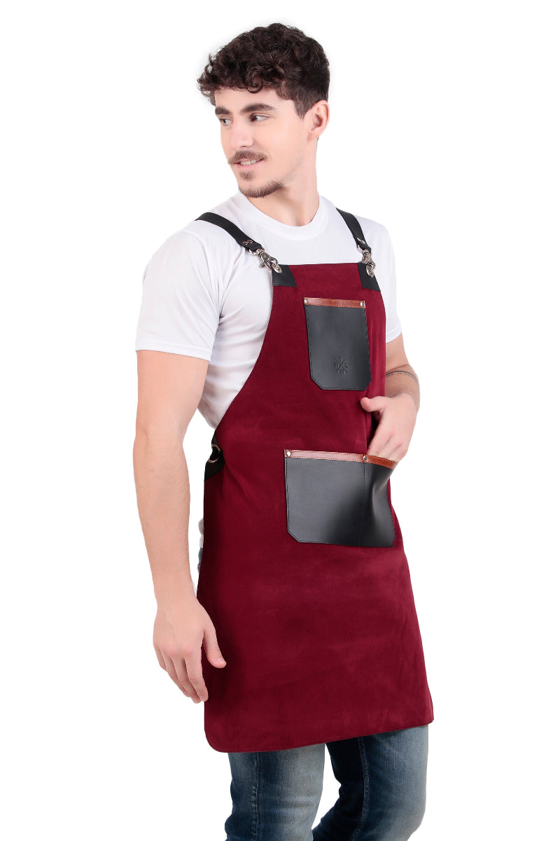 Man wearing a red apron with black pockets on a white background