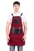 Man wearing a red apron with black leather pockets on a white background