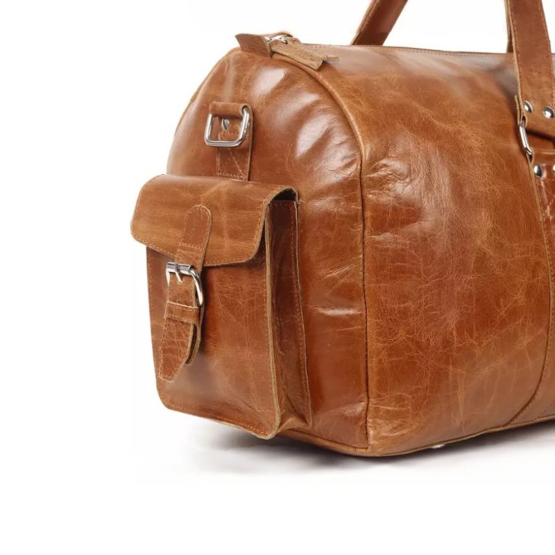 Brown leather duffel bag on a white background