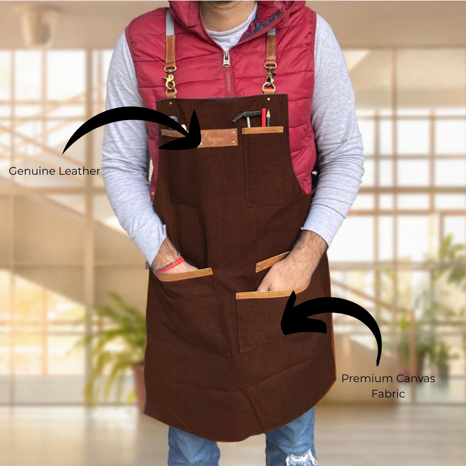 Person wearing a brown apron with leather straps, highlighting genuine leather and premium canvas fabric.