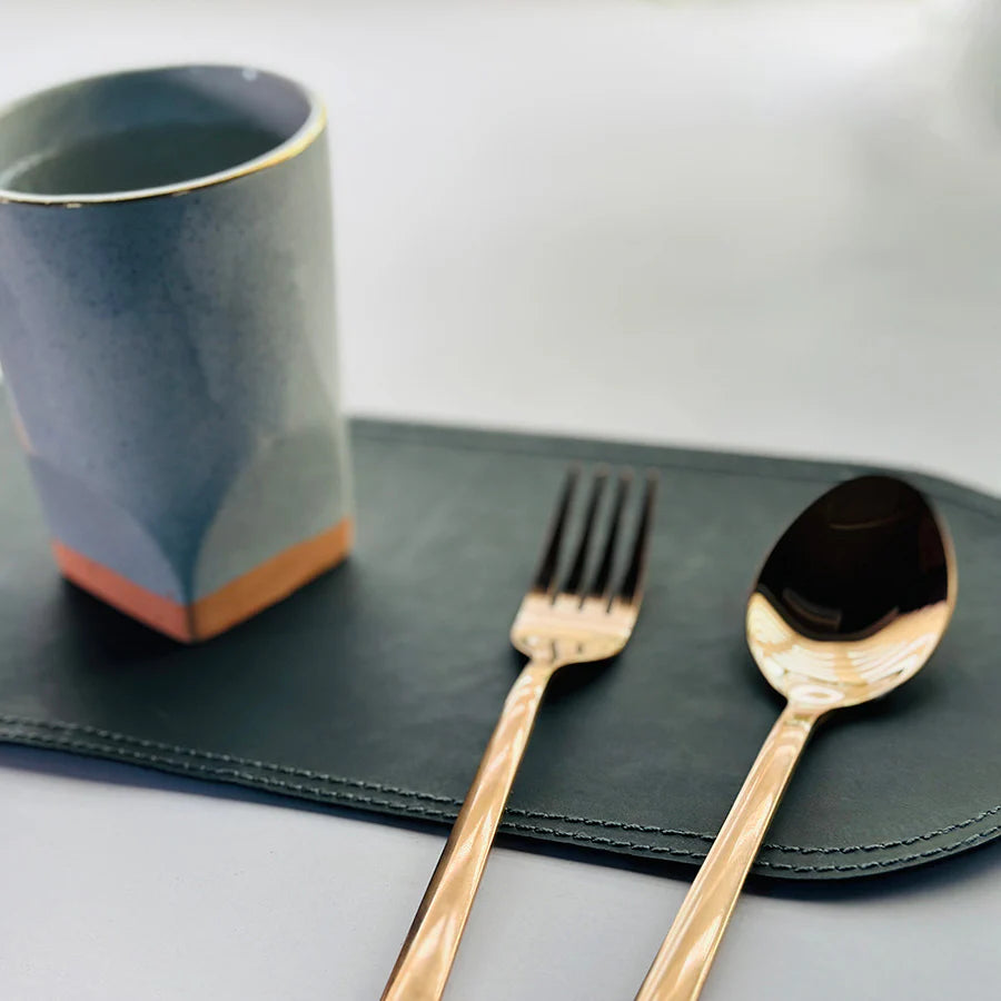 a placemat place spoen and forck and a cup