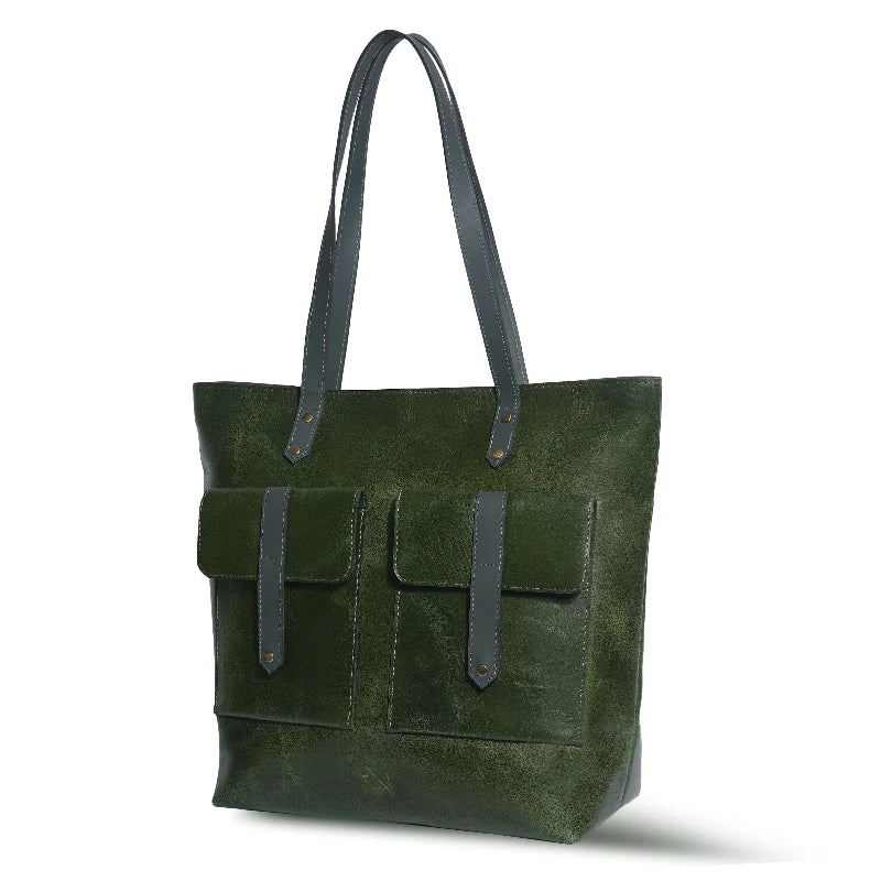 Green leather tote bag with dark green straps on a white background