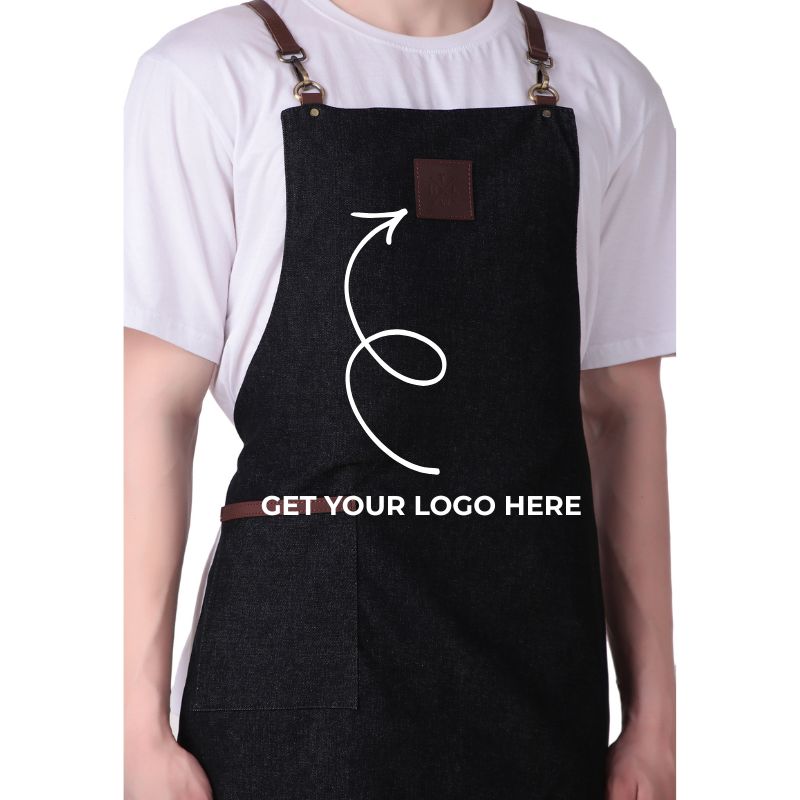 Person wearing a black apron with customizable text and logo area on a white background