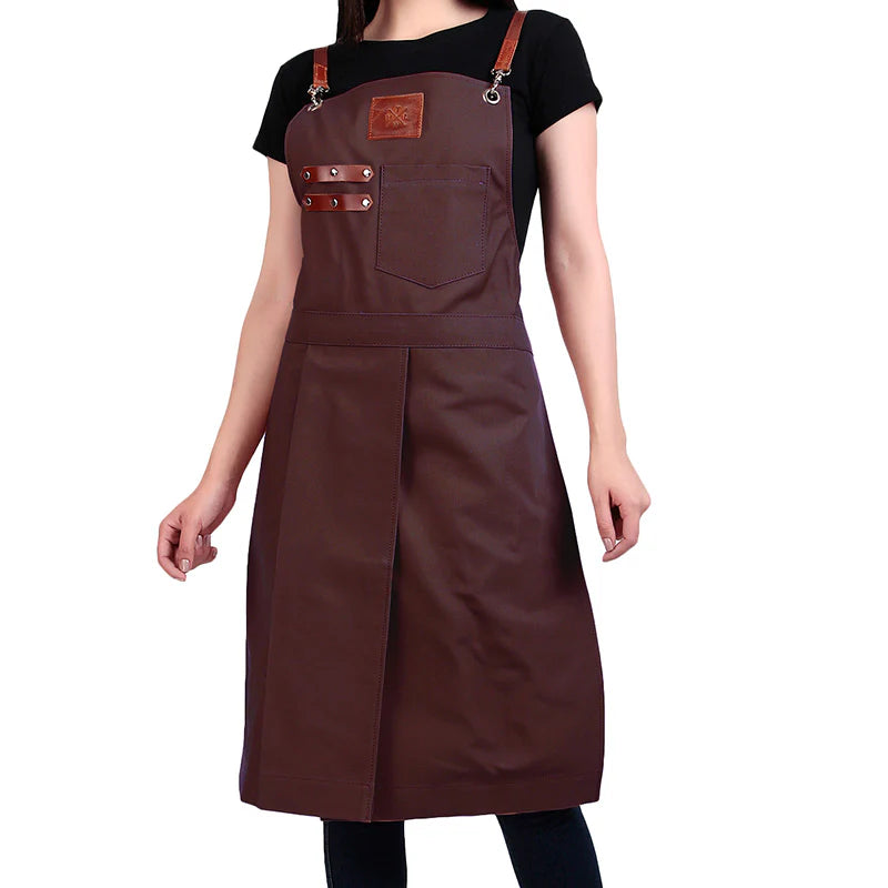 Brown apron with leather straps and pockets on a white background