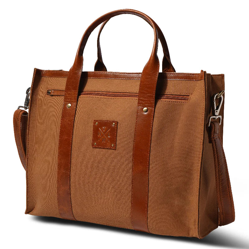 Brown tote bag with leather accents on a white background