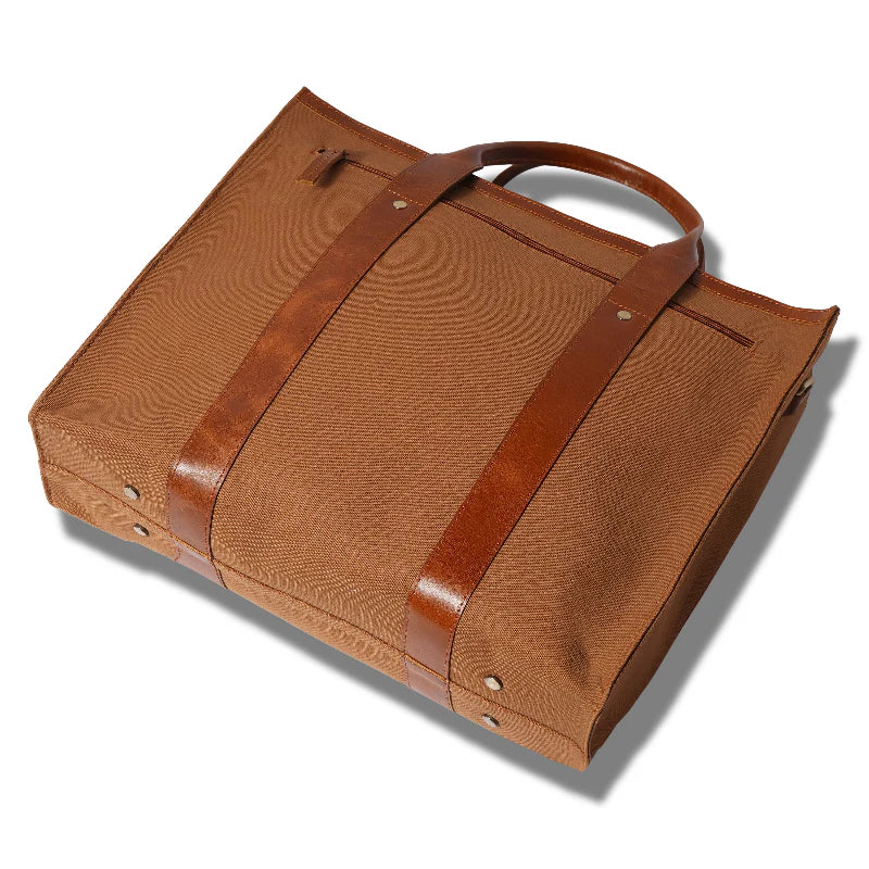 Brown textured bag with leather straps on a white background