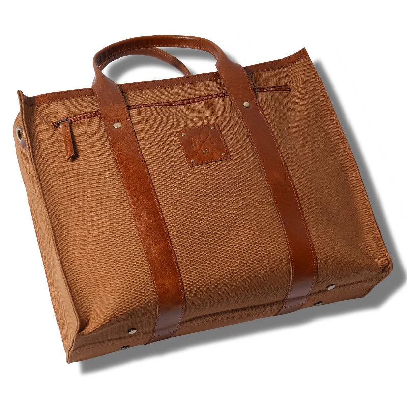 Brown leather bag with a prominent brand logo on a white background