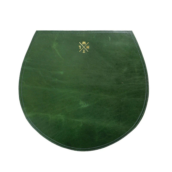 Green leather saddle pad with a logo on a white background