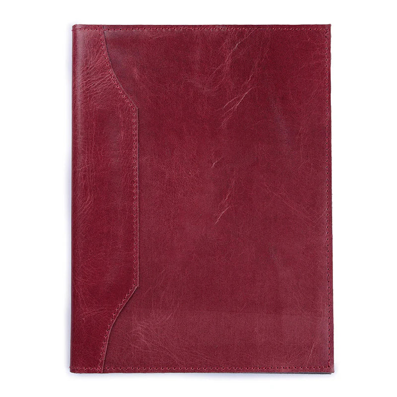 Red leather notebook cover on a white background