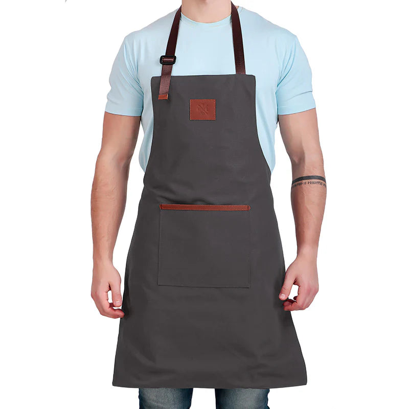 Person wearing a gray apron with brown accents on a white background