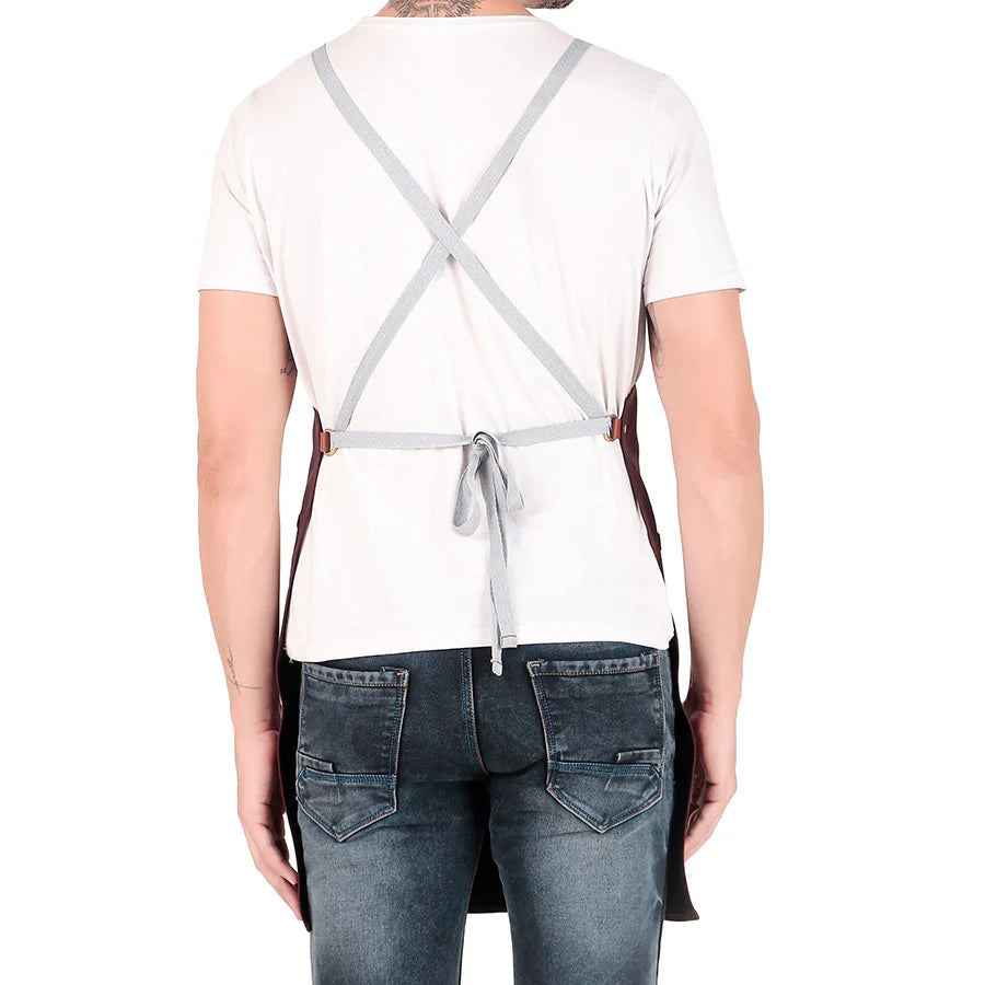 Person wearing a white shirt, gray apron, and blue jeans on a white background