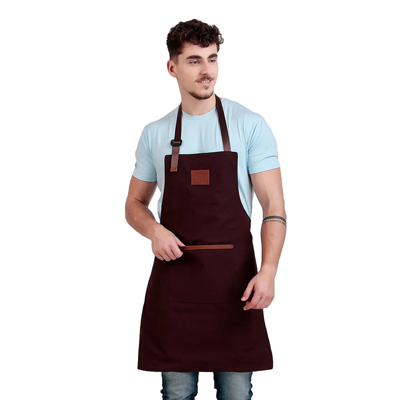 Man wearing a brown apron on a white background