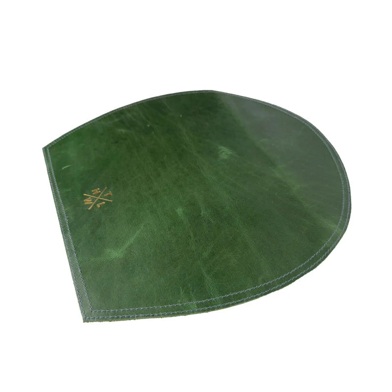 Green leather-bound book on a white background