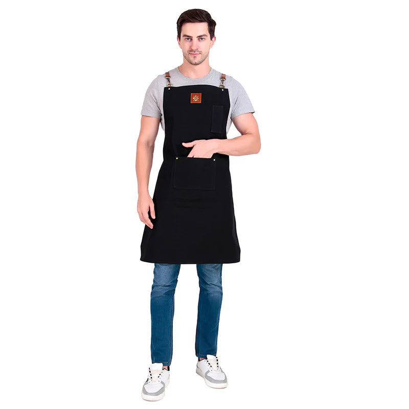 Man wearing a black apron on a white background