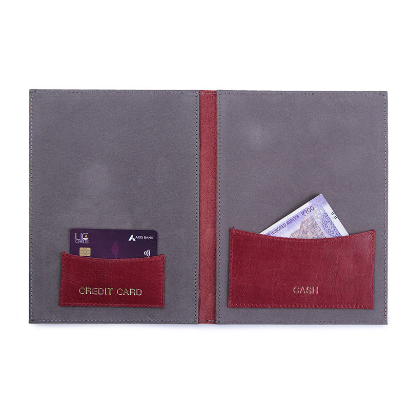 Gray wallet with red pockets for cards and cash on a white background