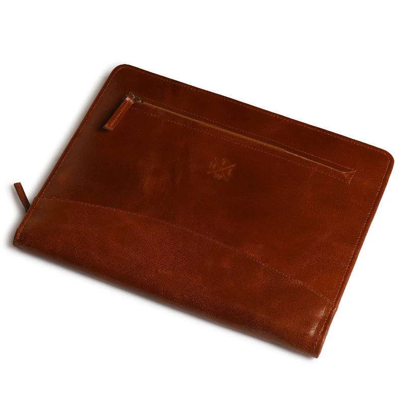 Brown leather pouch with a zipper on a white background