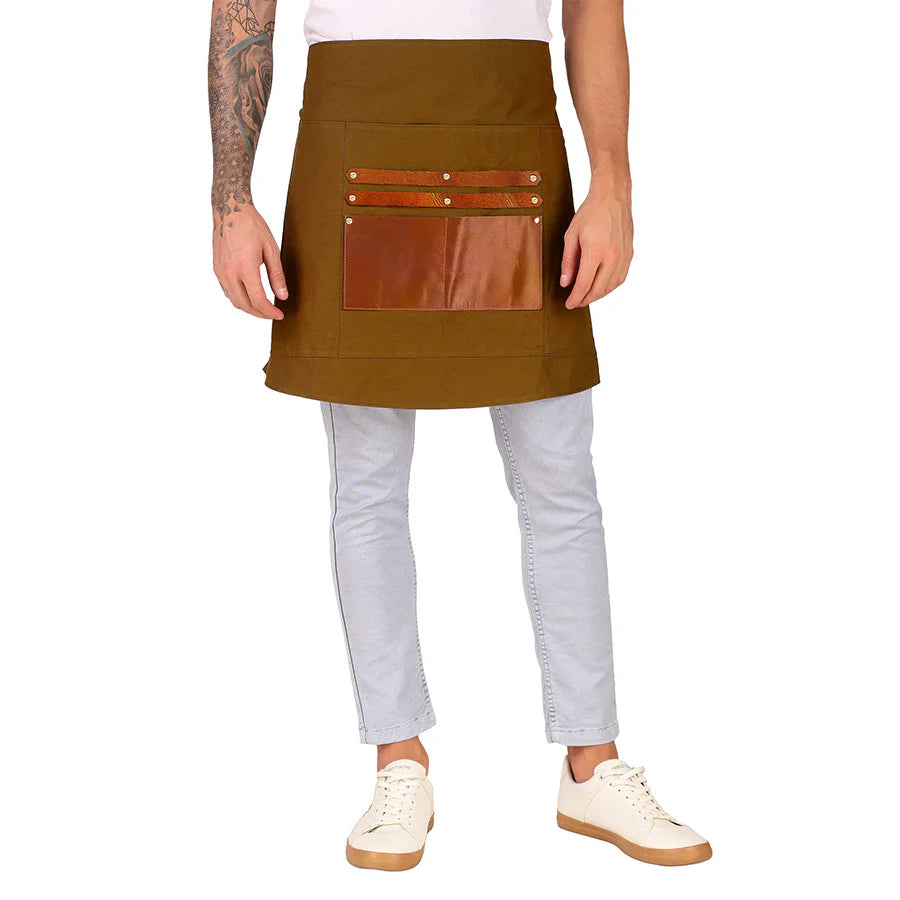 Person wearing a brown apron with leather pockets on a white background