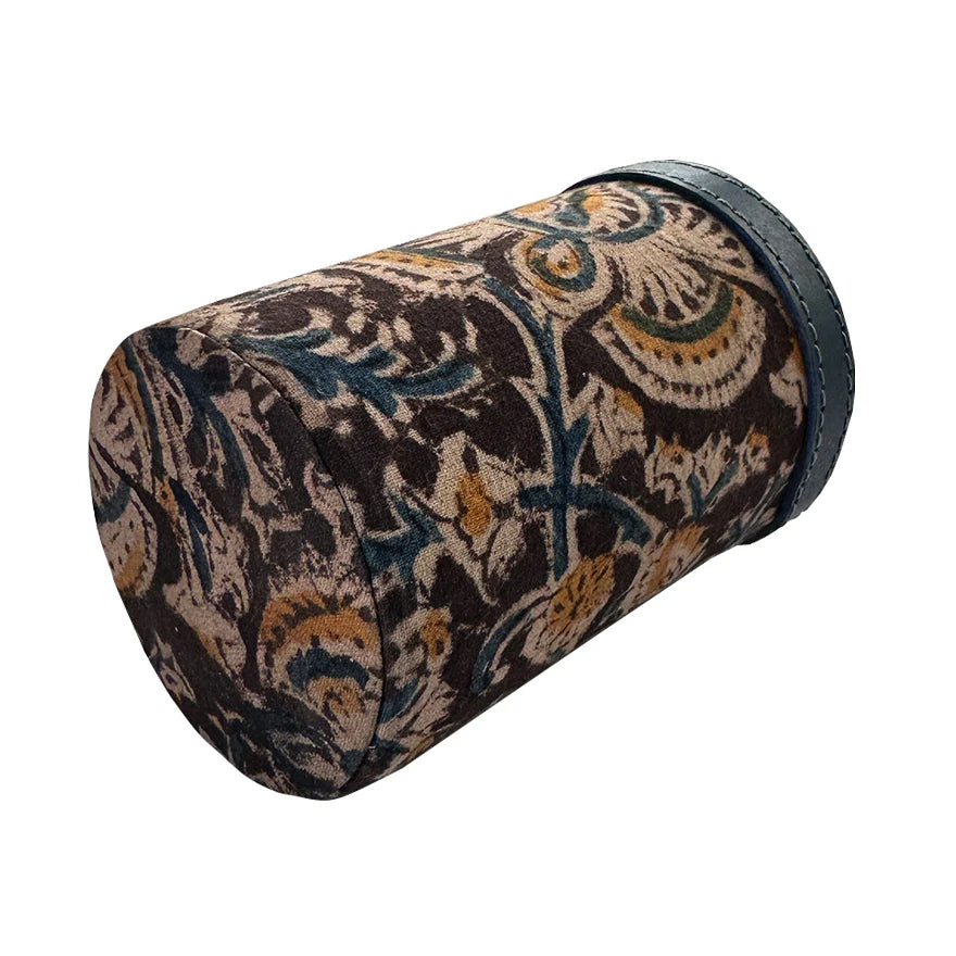 Decorative cylindrical pillow with a floral pattern on a white background