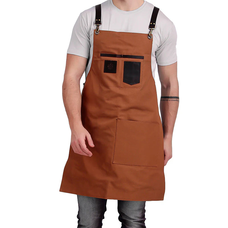 Brown apron with black accents worn by a person on a white background