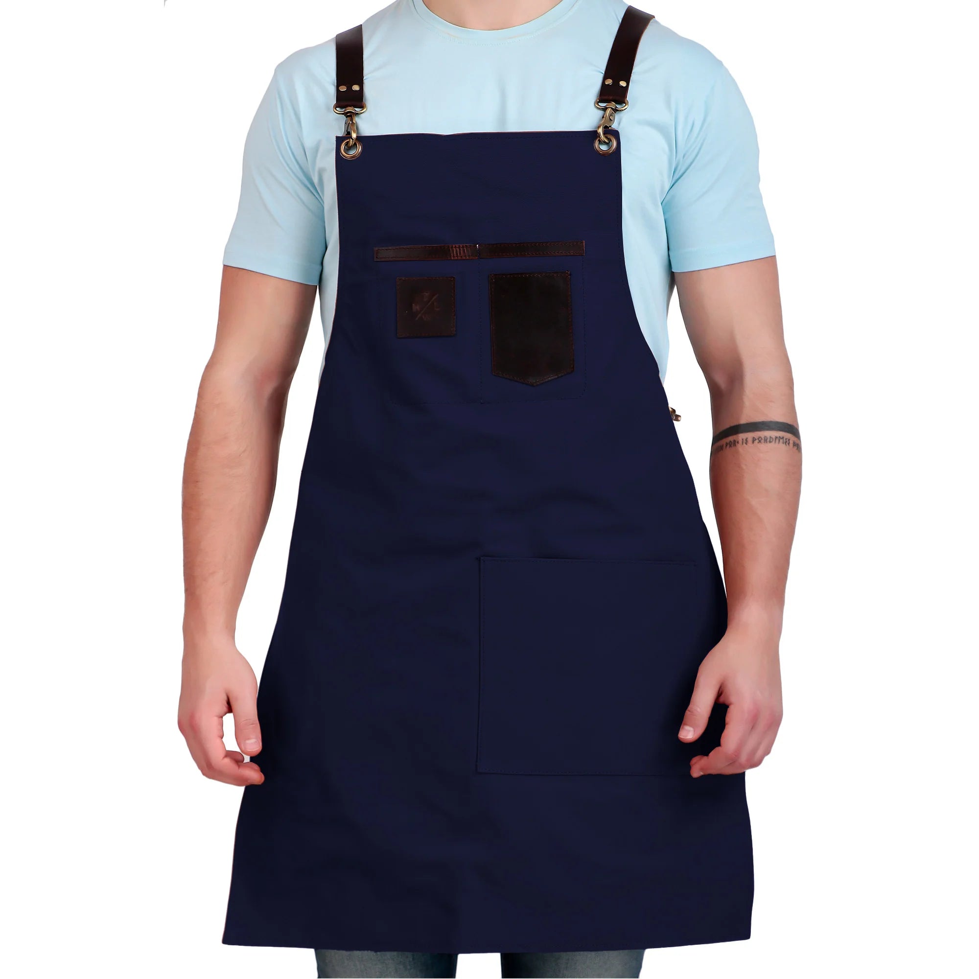 Person wearing a navy blue apron with brown straps on a white background