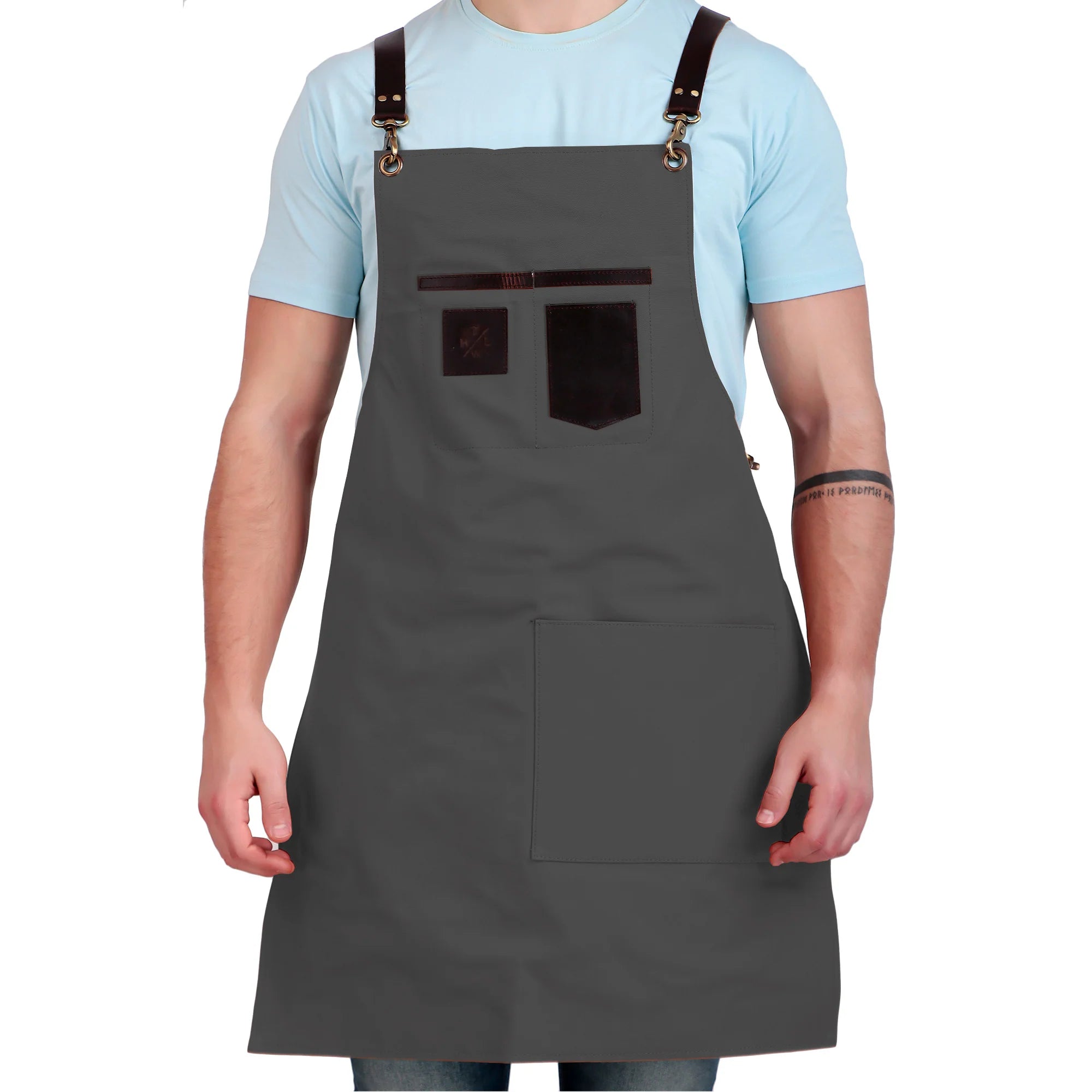 Person wearing a gray apron with brown straps on a white background
