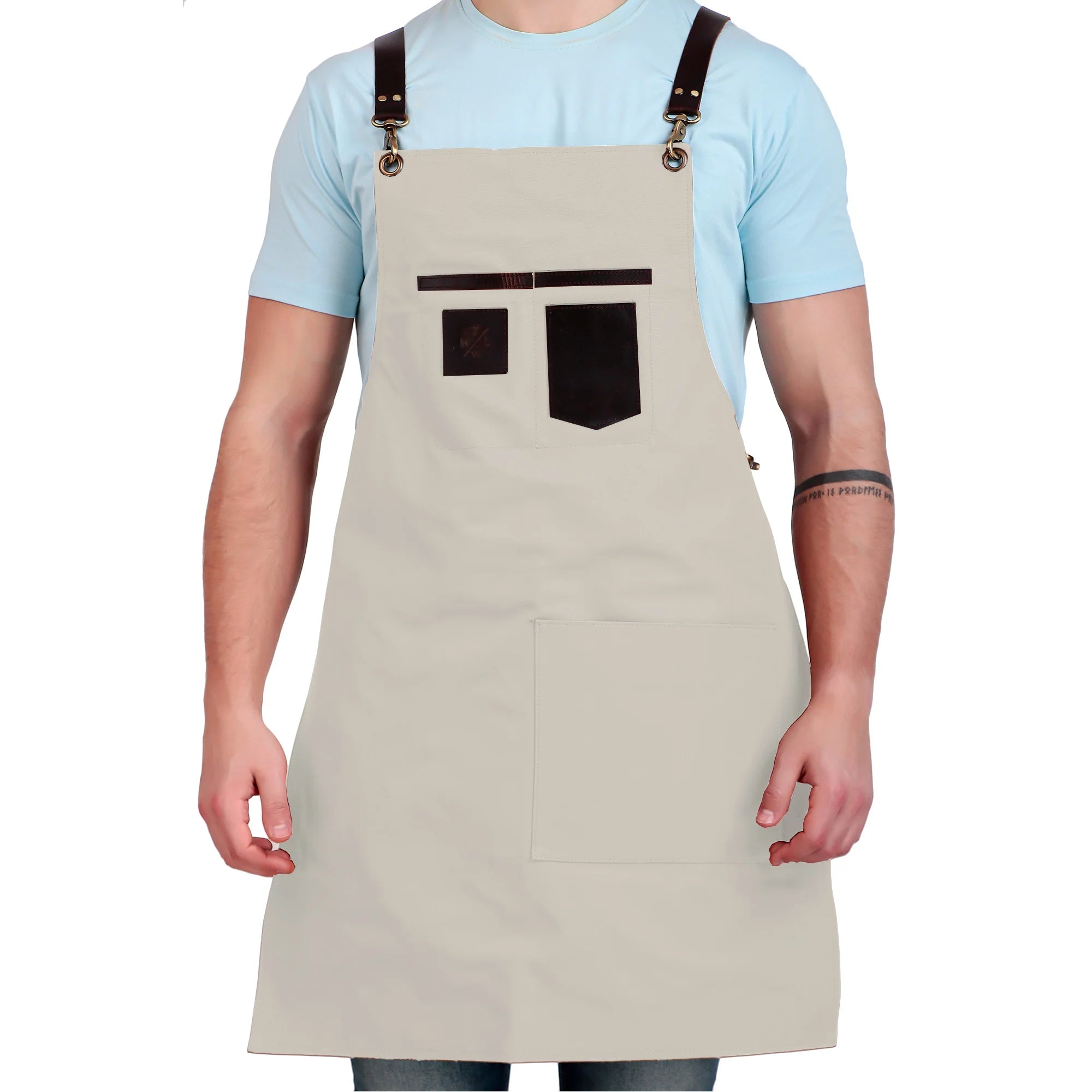 Person wearing a beige apron with brown leather straps on a white background