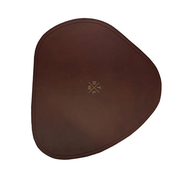 Brown leather saddle pad with a logo on a white background