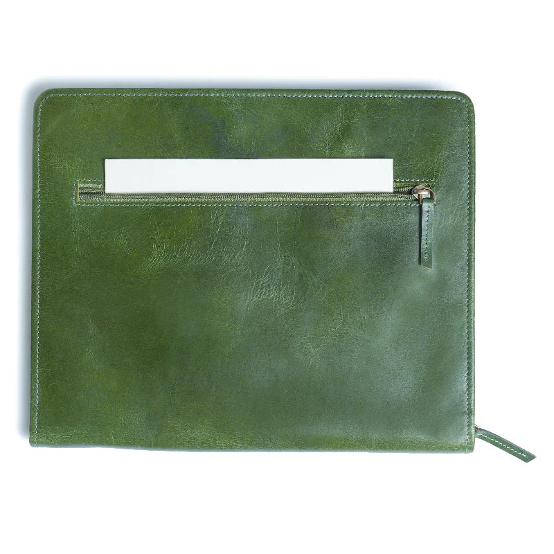Green leather clutch bag on a white background