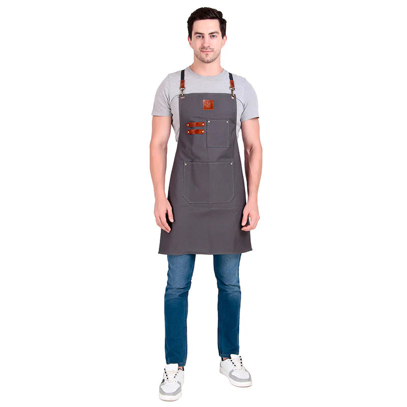 Man wearing a gray apron on a white background