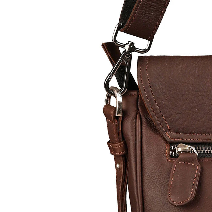 Brown leather crossbody bag with a strap on a white background