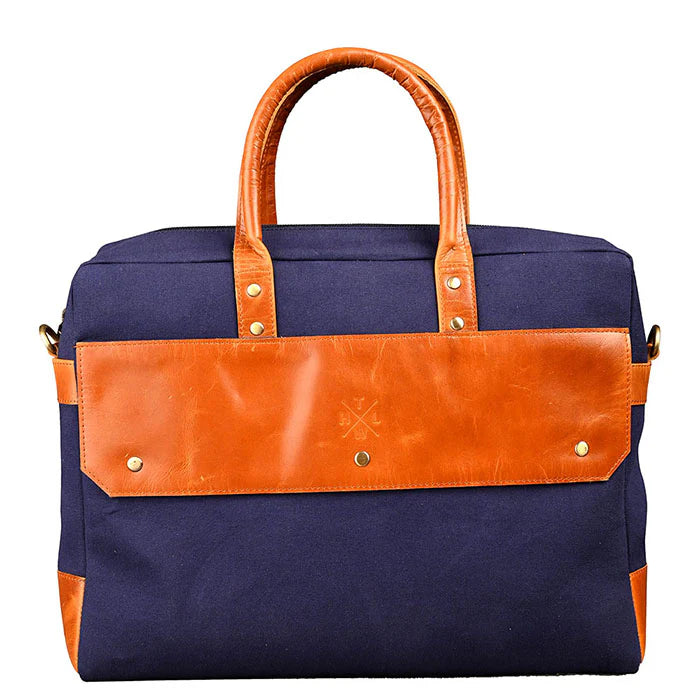 Navy blue bag with brown leather accents on a white background