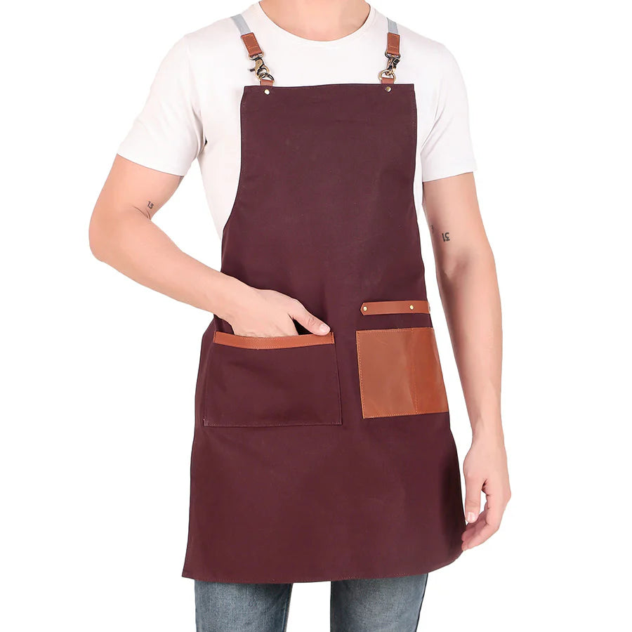 Person wearing a maroon apron with brown accents on a white background