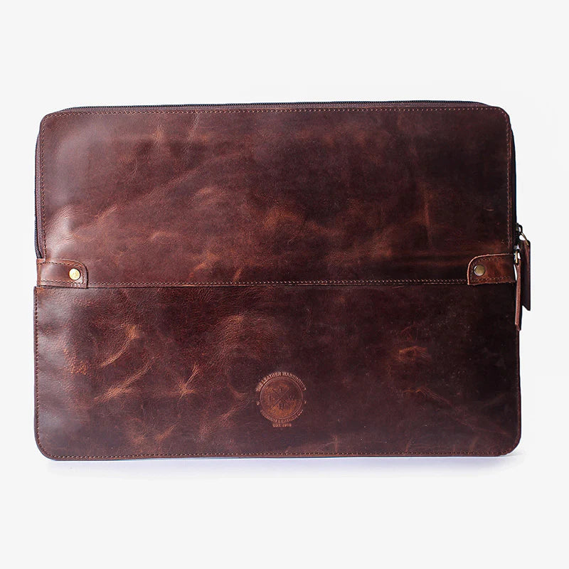Brown leather sleeve with visible branding on a white background