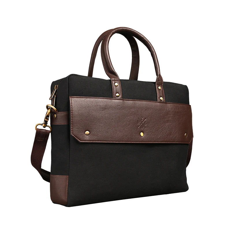 Black and brown handbag with gold accents on a white background