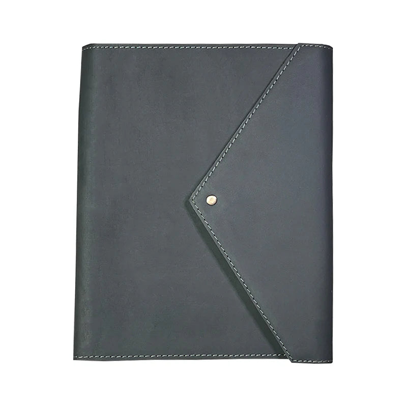 Dark gray leather notebook with corner flap and button on a white background