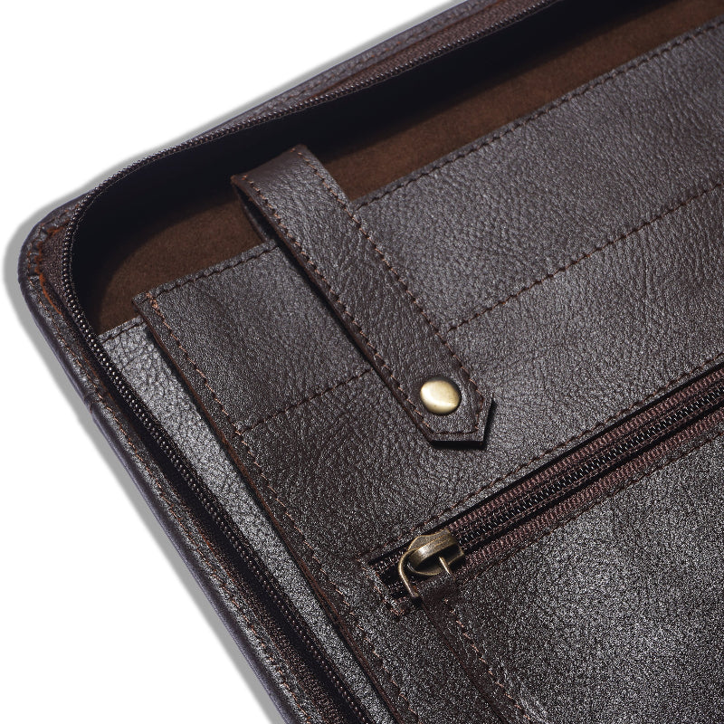 Close-up of a brown leather wallet with a zipper on a white background