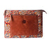 Brown leather pouch with colorful paisley pattern on a white background