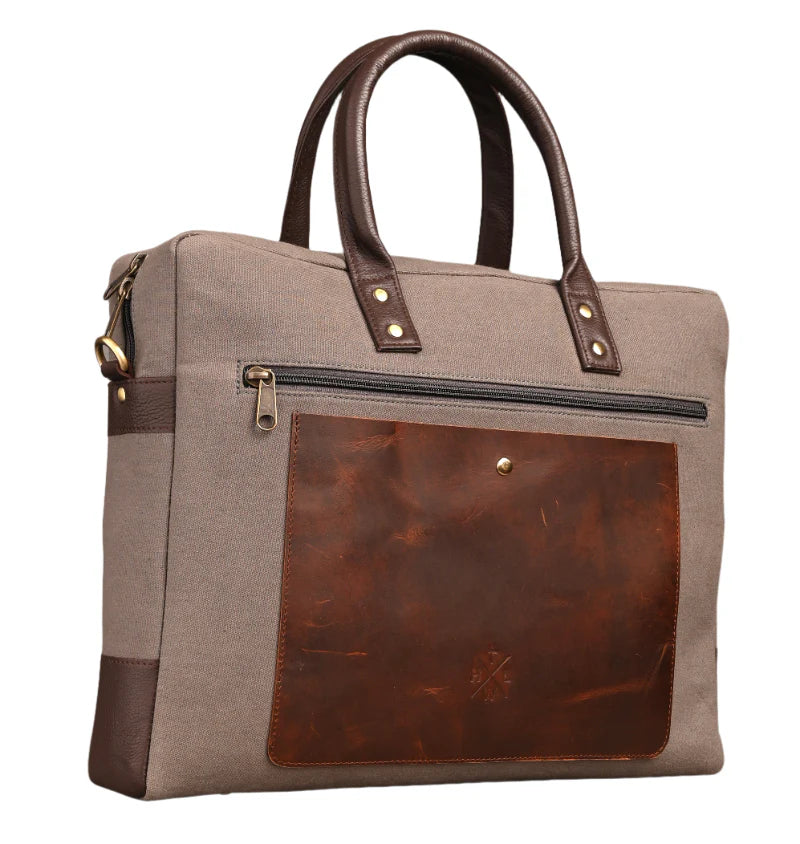 Brown and beige handbag with leather accents on a white background