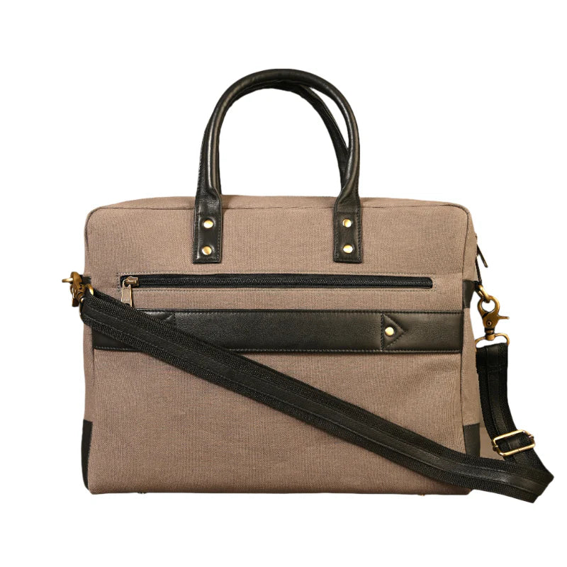 Beige handbag with black accents on a white background