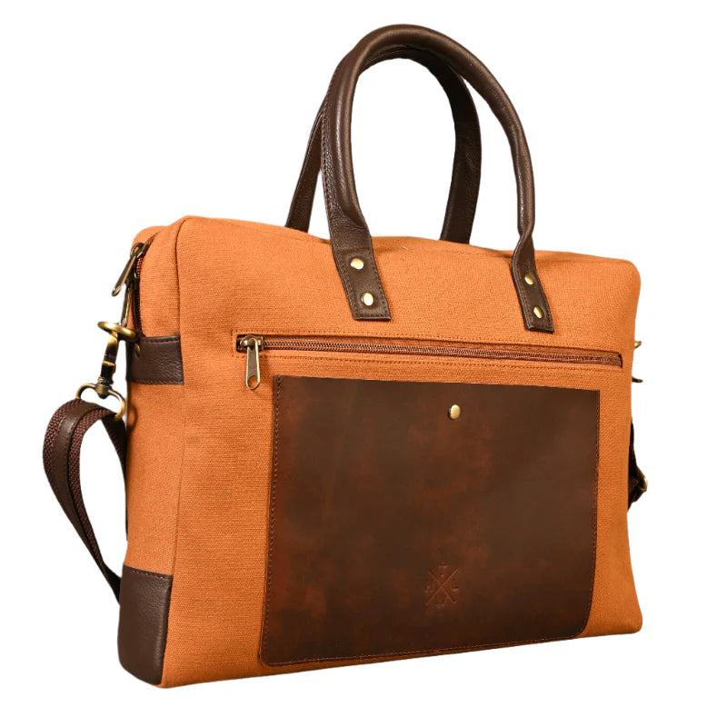 Brown and orange bag with leather accents on a white background