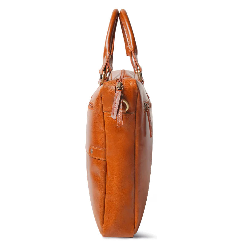 Brown leather handbag with handles on a white background