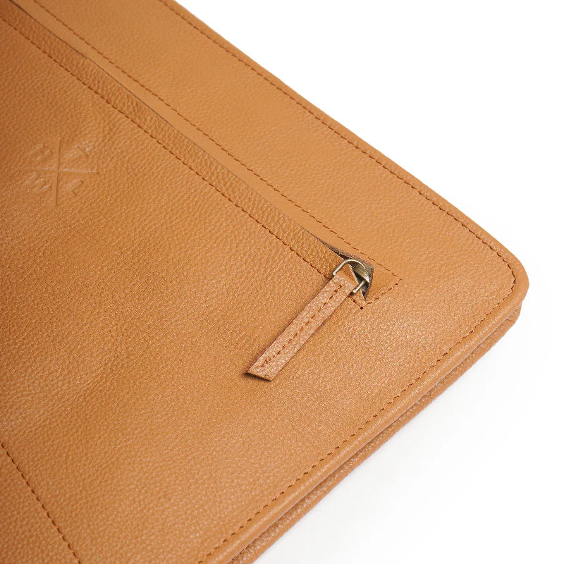 Close-up of a brown leather wallet with a strap on a white background