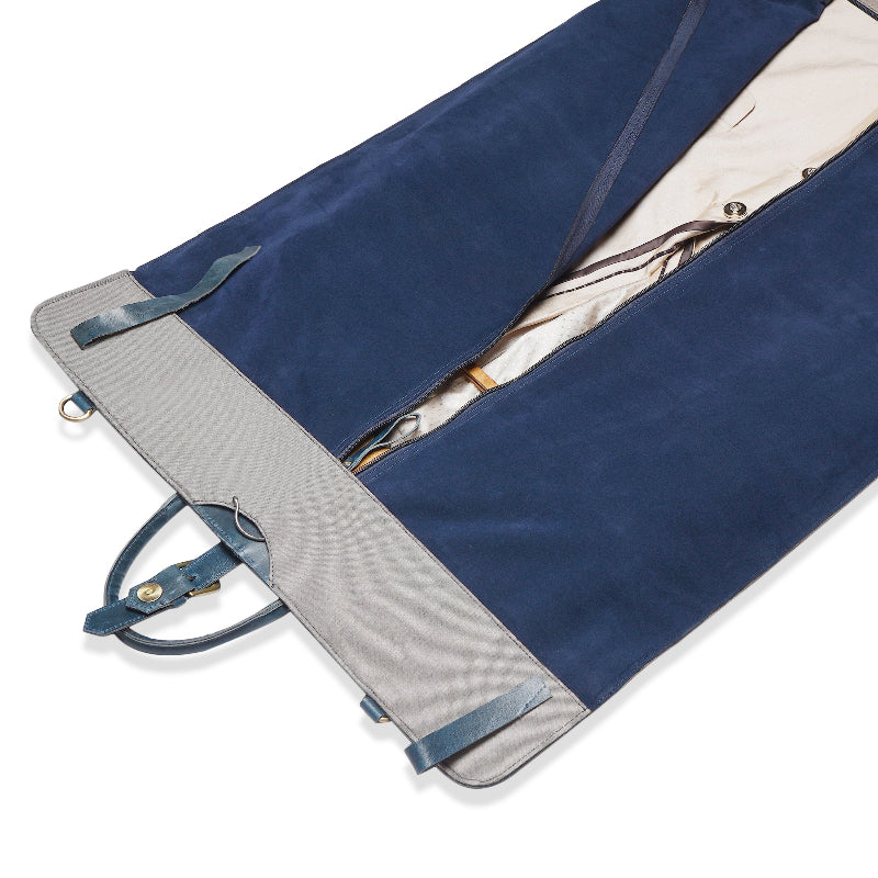 Navy blue garment bag with gray interior on a white background